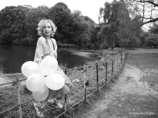Kate by the lake at Hampstead Heath with balloons